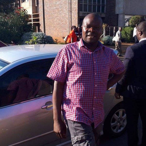 Amos Chibaya distributing mealie-meal in Mukoba (PIC via: Amos Chibaya)