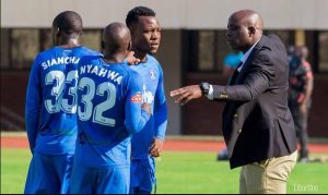 Dynamos coach Tonderai Ndiraya talking to his players during a water break.