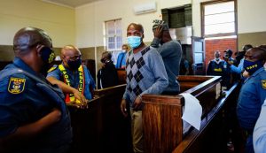 The suspects in the murder of a white farmer appearing in court in South Africa.