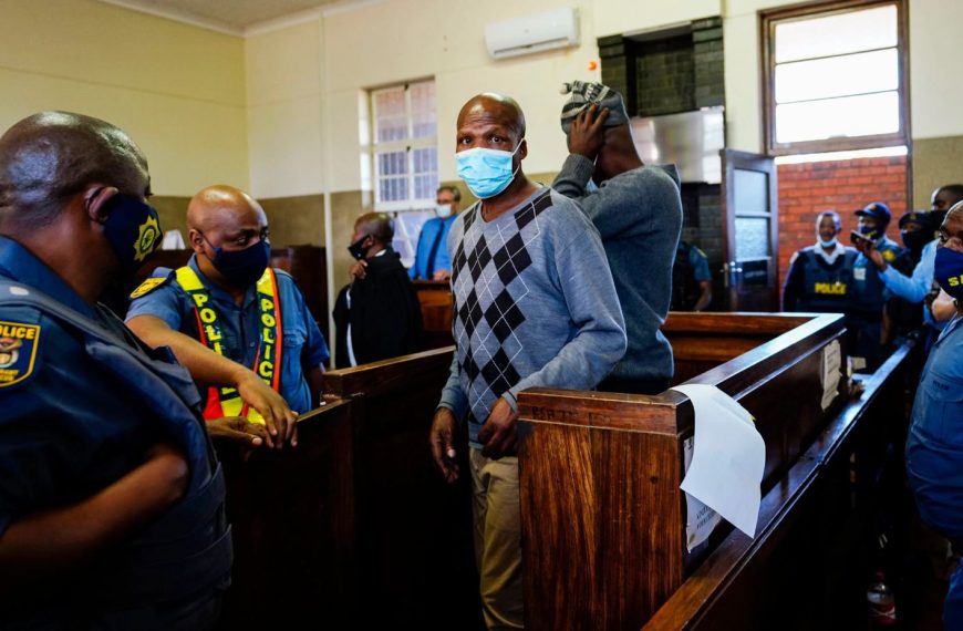 The suspects in the murder of a white farmer appearing in court in South Africa.