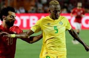 Zimbabwe defender Divine Lunga tussling for the ball against Egyptian forward Mohammed Salah at AFCON 2017 in Alexandre, Egypt