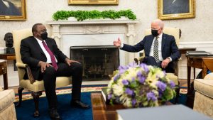 US President Biden (R) meets with Kenya's leader Kenyatta, in the Oval Office of the White House on October 14, 2021 in Washington, DC. (AFP) [African]