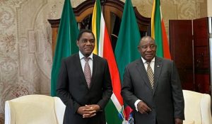 South Africa president Cyril Ramaphosa and his Zambian counterpart Hakainde Hichilema posing for a picture after holding bilateral talks in March 2022.