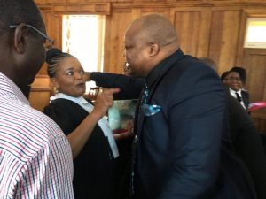 Job Sikhala embraces human rights lawyer after being granted bail.