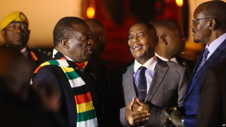 President Mnangagwa chats with his two deputies Constantino Chiwenga and Kembo Mohadi at a state function in Harare, Zimbabwe.