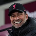 Liverpool manager Jurgen Klopp smiling for the camera at the Anfield stadium recently.