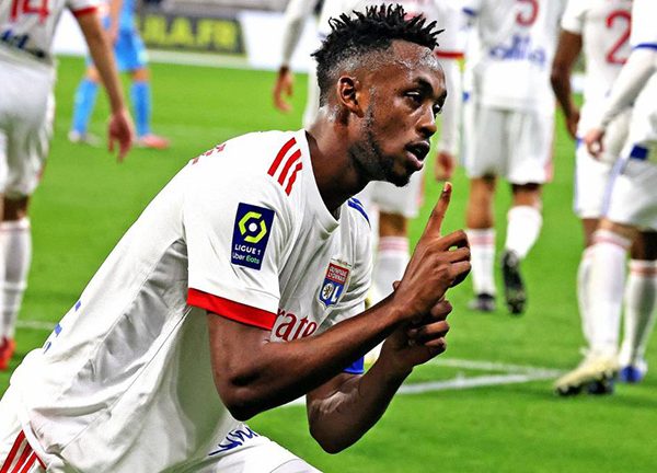Tino Kadewere celebrating a goal with Lyon teammates.