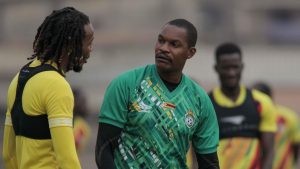 Home 6 Zimbabwe coach Norman Mapeza with diminutive midfielder Kundai Benyu