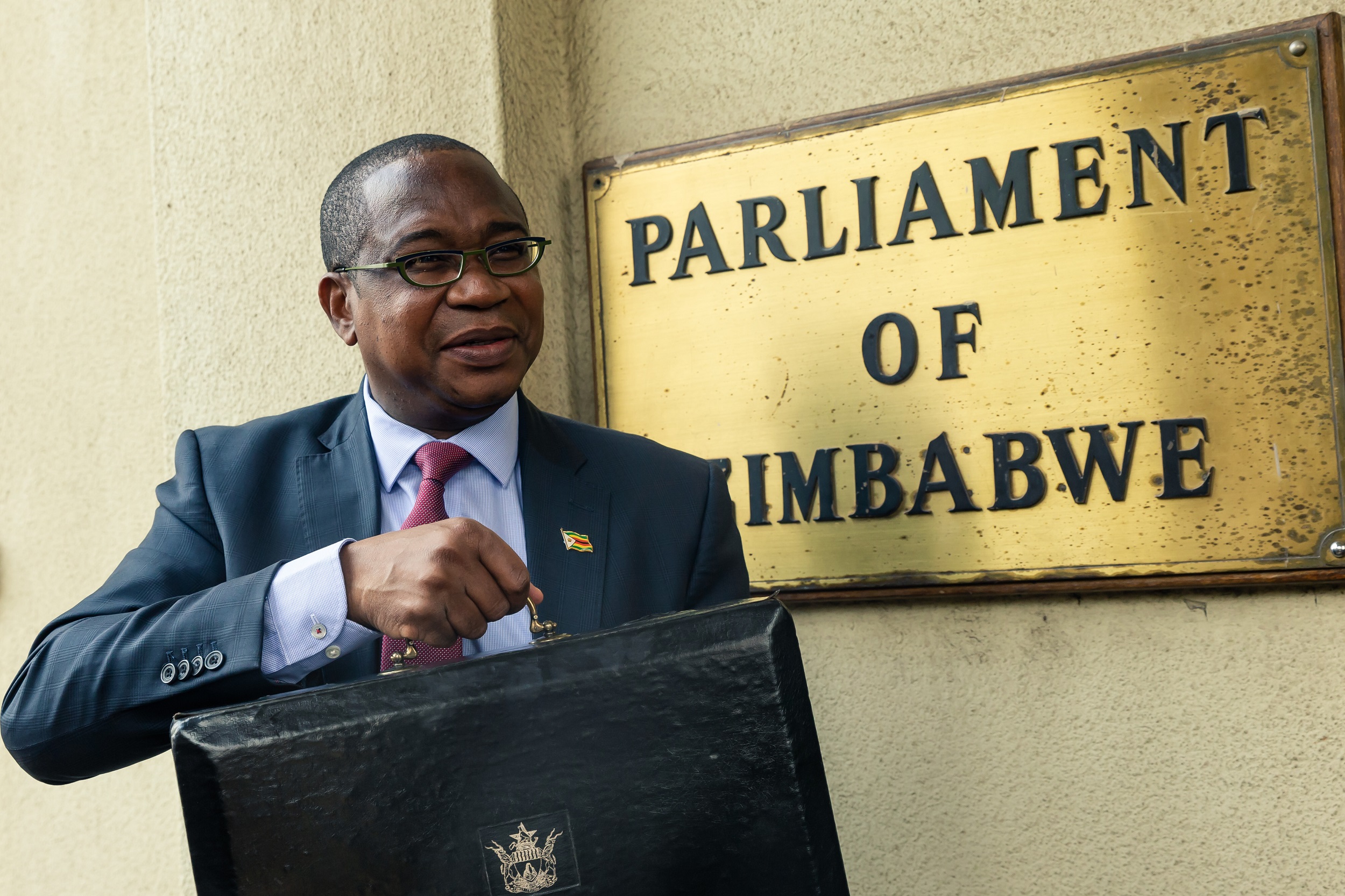 Zimbabwe Finance Minister Mthuli Ncube arrives at the Parliament of Zimbabwe to present the national annual budget, a few days after the introduction of a new currency in the country, in Harare, on November 14, 2019.