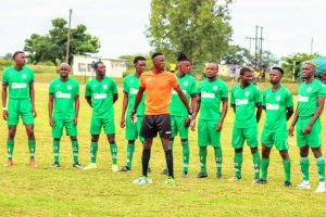 Green Fuel FC posing for a team photo before a game in the Eastern Region Soccer League.