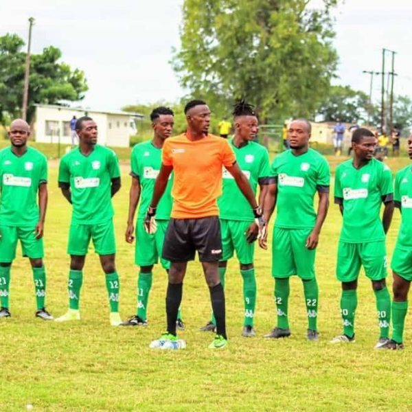 Green Fuel FC posing for a team photo before a game in the Eastern Region Soccer League.