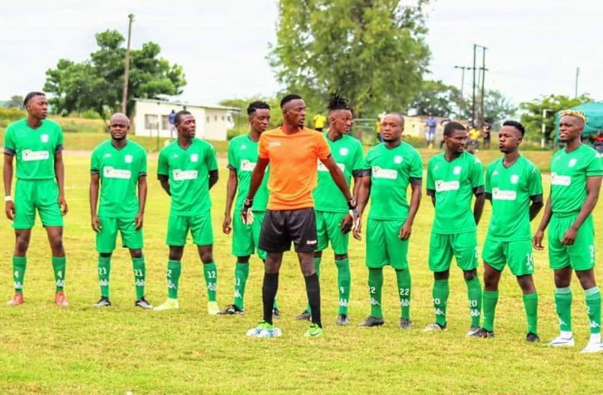 Green Fuel FC posing for a team photo before a game in the Eastern Region Soccer League.
