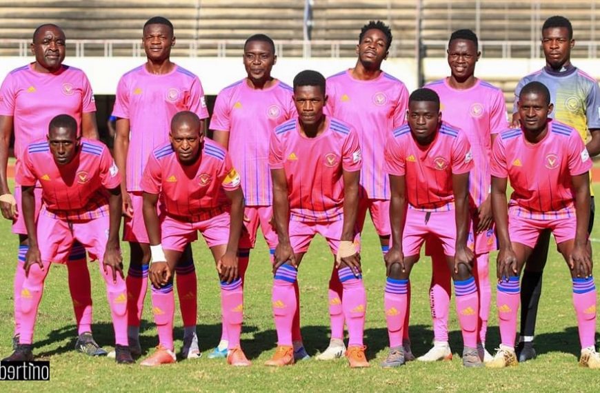 Herentals FC posing for a pre-match team photo before a game at the National Sports Stadium.
