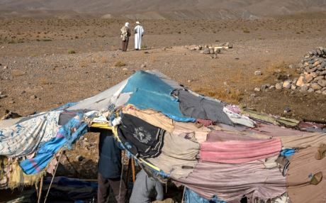 Climate change threatened Amazigh people sit in tents near the village of Amellagou where Morocco's last nomads reside, on September 2, 2022.
