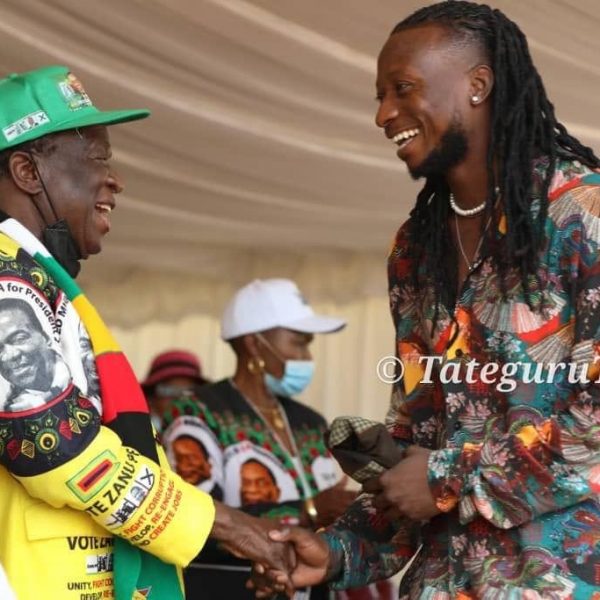 Jiti star Baba Harare sharing a lighter moment with Zanu PF leader Emmerson Mnangagwa at the party's Thank You rally in Mutasa South Constituency.