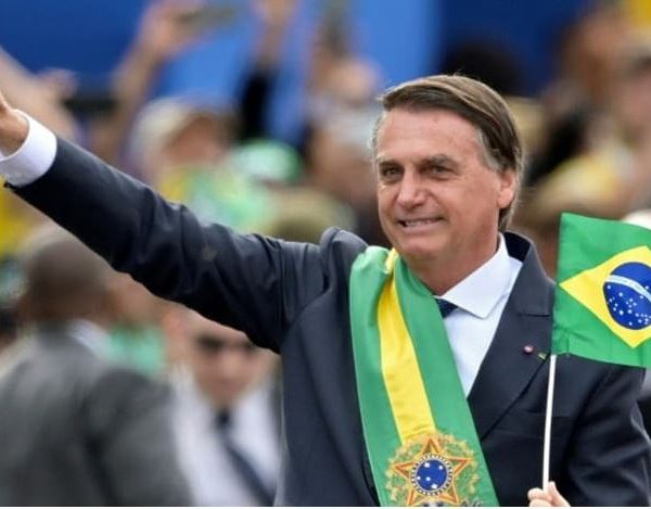 Home 2 Brazilian President Jair Bolsonaro waves at the crowd during a military parade to mark Brazil's 200th anniversary of independence in Brasilia on Sep 7, 2022.
