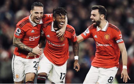 Manchester United players celebrate a goal in their English Premier League match against Tottenham on 19 October 2022.