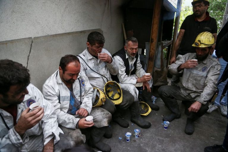 Members of a rescue team rest outside the coal mine as search and rescue operation continues after an explosion, in Amasra in the northern Bartin province, Turkey October 15, 2022.