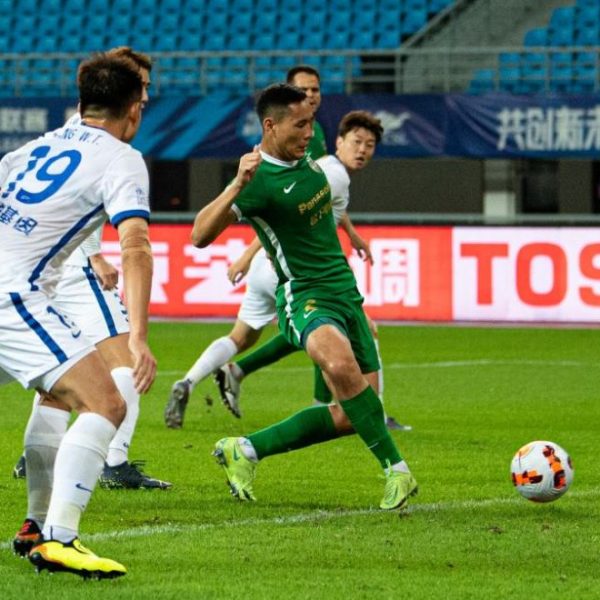 Leung Nok Hang of Zhejiang FC shoots to score during a 2022 season Chinese Football Association Super League (CSL) match between Zhejiang FC and Wuhan Three Towns in Huzhou, east China's Zhejiang Province, Oct. 4, 2022.
