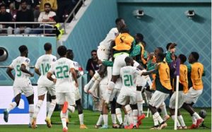 Senegal's players celebrate after defender Kalidou Koulibaly scored their team's second goal during the Qatar 2022 World Cup Group A football match between Ecuador and Senegal at the Khalifa International Stadium in Doha on 29 November 2022.