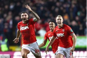 Charlton Athletic players celebrates after defeating English Premier League side Brighton and Hove on Wednesday 21st December 2022 in the Carabao Cup to qualify for the quarterfinals.