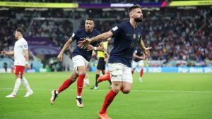 Home 6 France record goalscorer Olivier Giroud and Kylian Mbappe celebrating a goal during a FIFA World Cup 2022 match in Qatar.