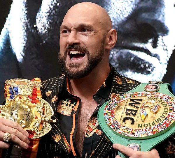 Home 165 British boxer Tyson Fury showing off his British heavyweight titles. Derek Chisora