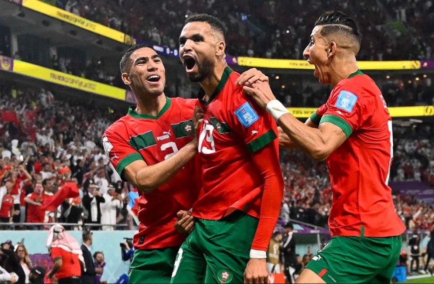 Morocco's forward #19 Youssef En-Nesyri (C) celebrates with teammates after scoring the opening goal during the Qatar 2022 World Cup quarter-final football match between Morocco and Portugal at the Al-Thumama Stadium in Doha on December 10, 2022.