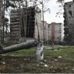 This photograph taken on 23 December 2022 shows heavily damaged residential buildings in Irpin, northwest of Kyiv, amid the Russian invasion of Ukraine.