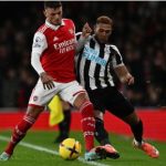 Arsenal defender Ben White (L) vies with Newcastle United striker Joelinton during the English Premier League football match between Arsenal and Newcastle United at the Emirates Stadium in London on 3 January 2023.