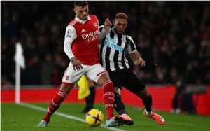 Arsenal defender Ben White (L) vies with Newcastle United striker Joelinton during the English Premier League football match between Arsenal and Newcastle United at the Emirates Stadium in London on 3 January 2023.