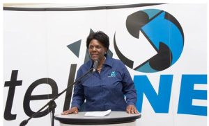 Home 7 TelOne former managing director Chipo Mtasa delivering a speech at a telecommunications symposium.