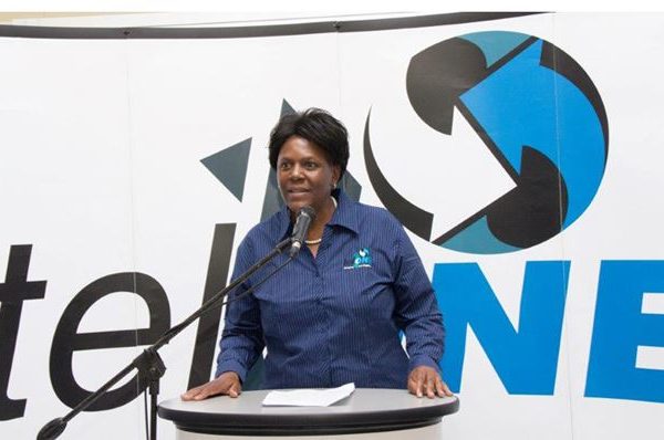 Home 24 TelOne former managing director Chipo Mtasa delivering a speech at a telecommunications symposium.