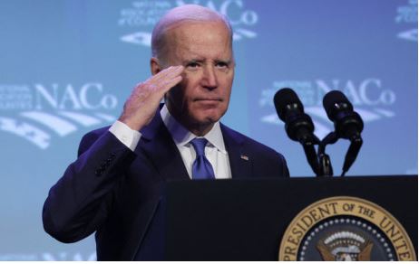 US President Joe Biden salutes as he delivers remarks at the National Association of Counties legislative conference at the Washington Hilton Hotel on 14 February 2023 in Washington, DC.