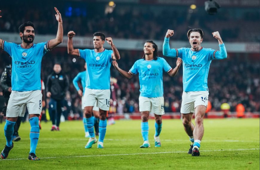 Manchester City players celebrating on Wednesday after beating Arsenal 3-1 to go top of the English Premier League while their opponents dropped to second.