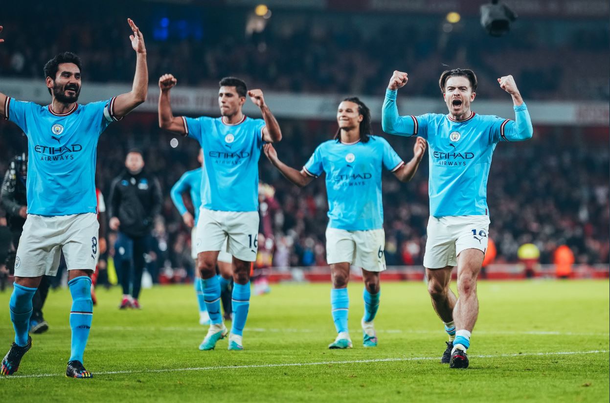 Manchester City players celebrating on Wednesday after beating Arsenal 3-1 to go top of the English Premier League while their opponents dropped to second.