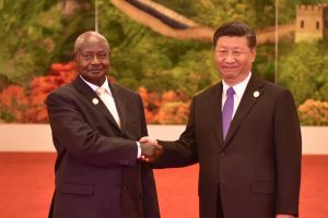 Home 8 Ugandan President Yoweri Museveni and China President Xi Jinping shake hands at a state event.