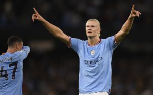 Manchester City striker Erling Haaland celebrates after scoring the team's third goal during the English Premier League football match between Manchester City and Nottingham Forest at the Etihad Stadium in Manchester, north west England, on 31 August 2022.