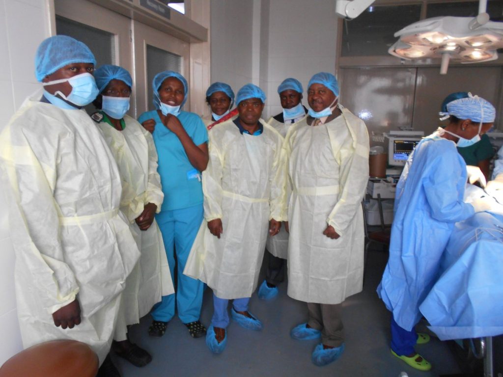 Health minister Obadiah Moyo with health practitioners at Sally Mugabe Hospital.