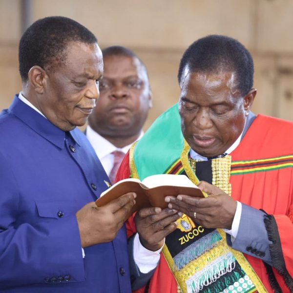President Emmerson Mnangagwa reads the bible while Vice President Constantino Chiwenga looks on during a Pastors for Economic Development Conference which was held at the City Sports Centre in Harare on Thursday 30th March 2023.