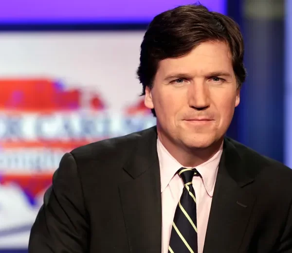 Tucker Carlson, host of “Tucker Carlson Tonight,” poses for photos in a Fox News Channel studio on March 2, 2017, in New York. Fox News says it has agreed to part ways with Tucker Carlson, less than a week.