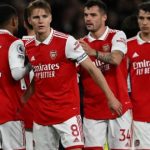 Arsenal midfielder Martin Odegaard (8) celebrates with teammates after the English Premier League football match between Arsenal and Chelsea at the Emirates Stadium, in London, on May 2, 2023. Arsenal won the match 3-1.