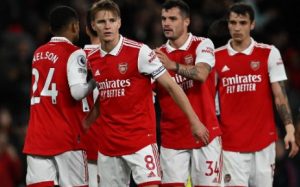 Arsenal midfielder Martin Odegaard (8) celebrates with teammates after the English Premier League football match between Arsenal and Chelsea at the Emirates Stadium, in London, on May 2, 2023. Arsenal won the match 3-1.