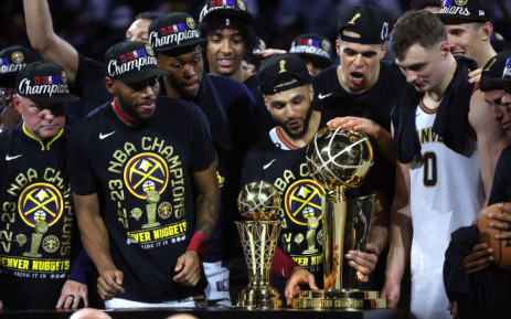 The Denver Nuggets celebrate with the Larry O'Brien Championship Trophy after a 94-89 victory against the Miami Heat in Game Five of the 2023 NBA Finals to win the NBA Championship at Ball Arena on 12 June 2023 in Denver, Colorado.