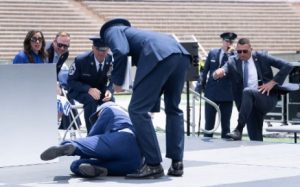 US President Joe Biden falls during the graduation ceremony at the United States Air Force Academy, just north of Colorado Springs in El Paso County, Colorado, on 1 June 2023.
