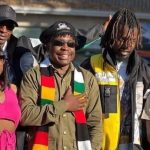 Zimbabwe music stars Kikky Badass, Holy Ten, Enzo Ishall, Michael Magz pose for a group photo clad in Zanu PF regalia.