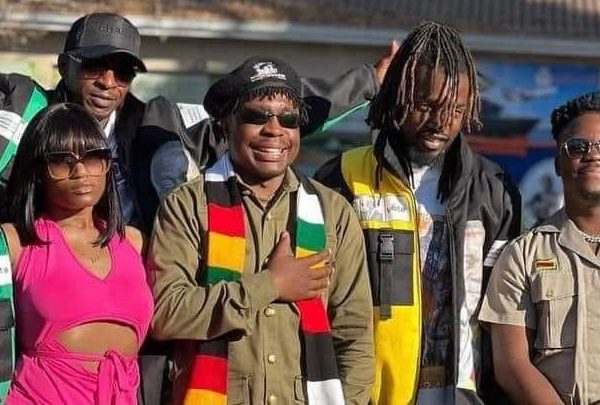 Zimbabwe music stars Kikky Badass, Holy Ten, Enzo Ishall, Michael Magz pose for a group photo clad in Zanu PF regalia.