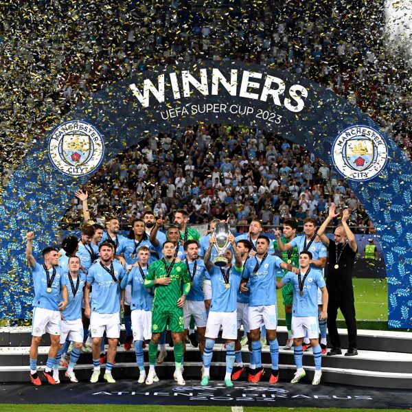 Manchester City players celebrate with the trophy after the UEFA Super Cup football match between Manchester City vs Sevilla in Athens, on August 16, 2023. - Manchester City won the match 5-4 on penalties.