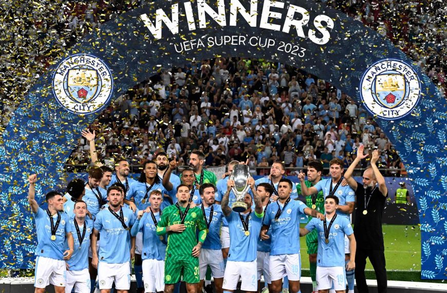 Home 135 Manchester City players celebrate with the trophy after the UEFA Super Cup football match between Manchester City vs Sevilla in Athens, on August 16, 2023. - Manchester City won the match 5-4 on penalties.