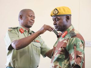 Presidential Guard commander Brigadier General Anselem Sanyatwe in 2018 with Zimbabwe Army General Valerio Sibanda (in brown shirt).